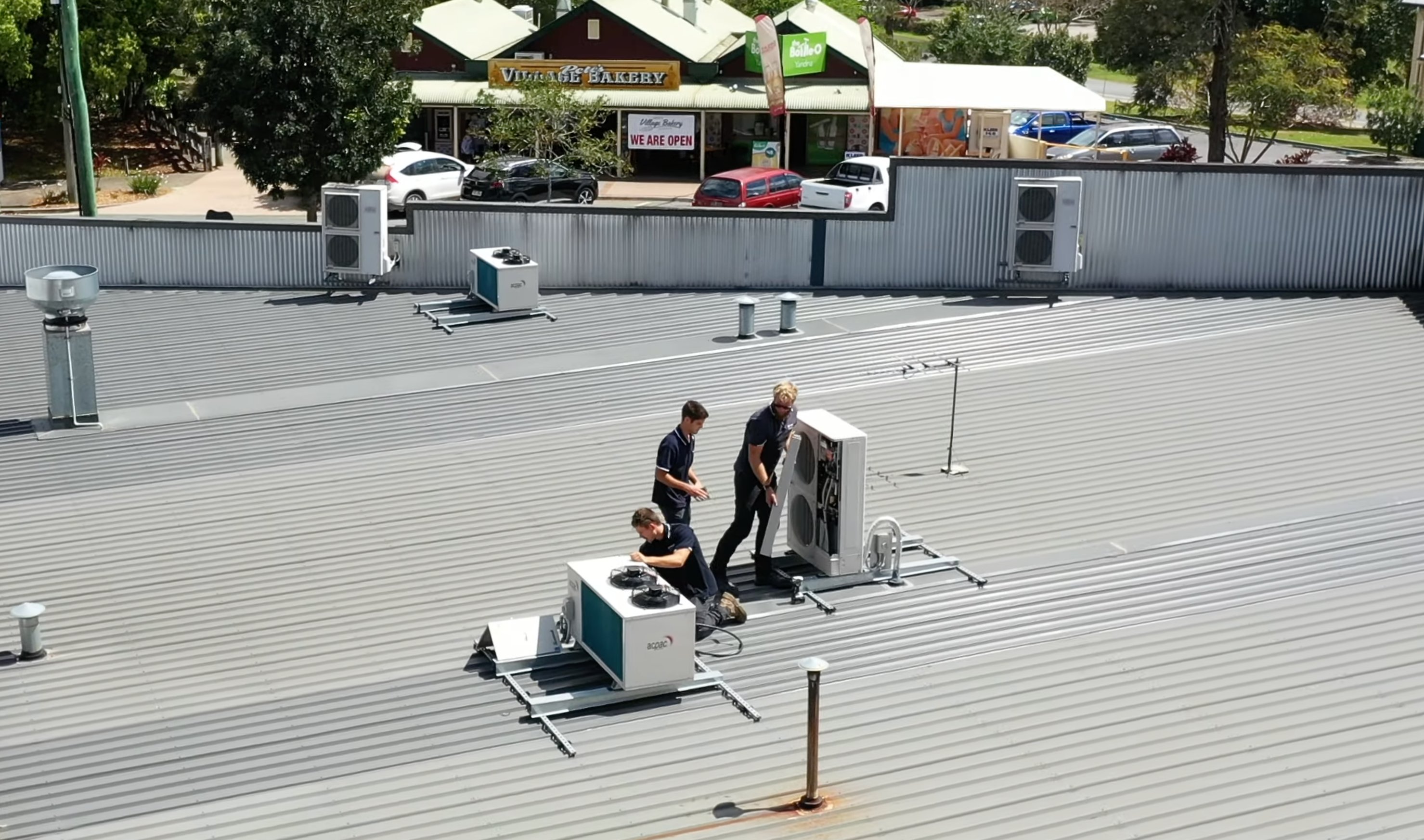 SETPOINT team working on a rooftop refrigeration installation