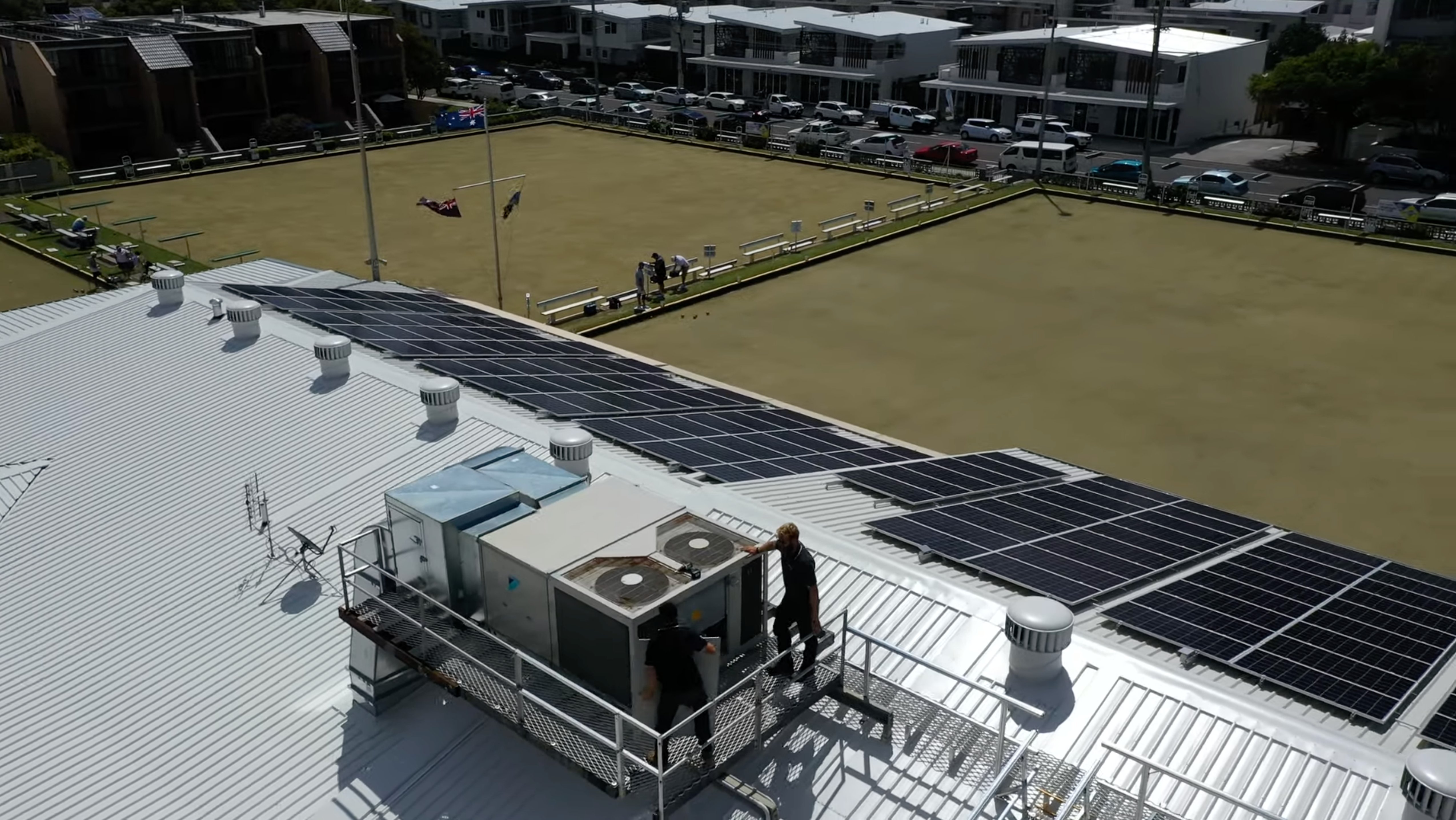 SETPOINT technicians servicing a packaged rooftop air conditioning unit at a Sunshine Coast bowls club
