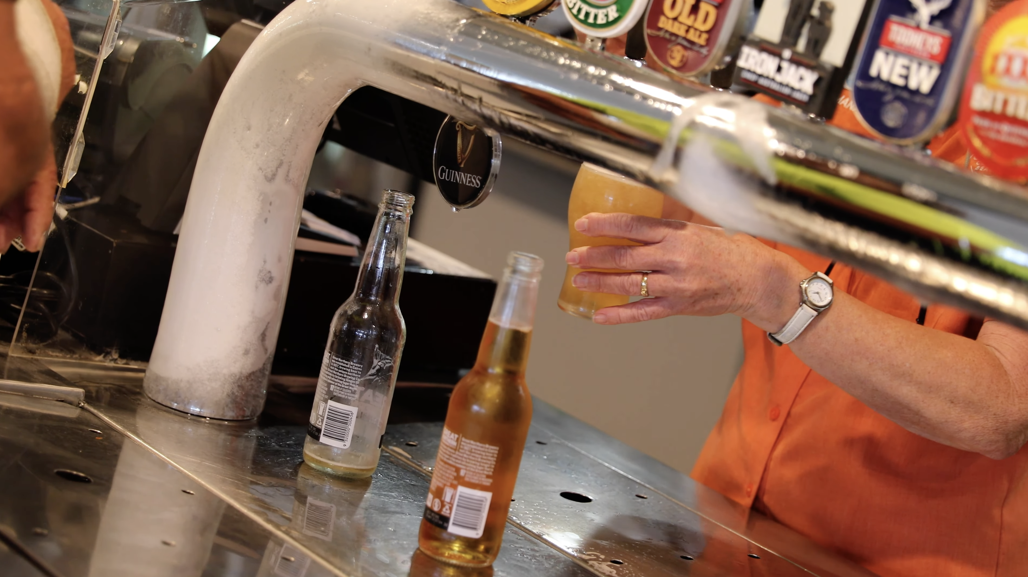 A cold beer poured at a hospitality venue bar — temperature-critical refrigeration keeping product right
