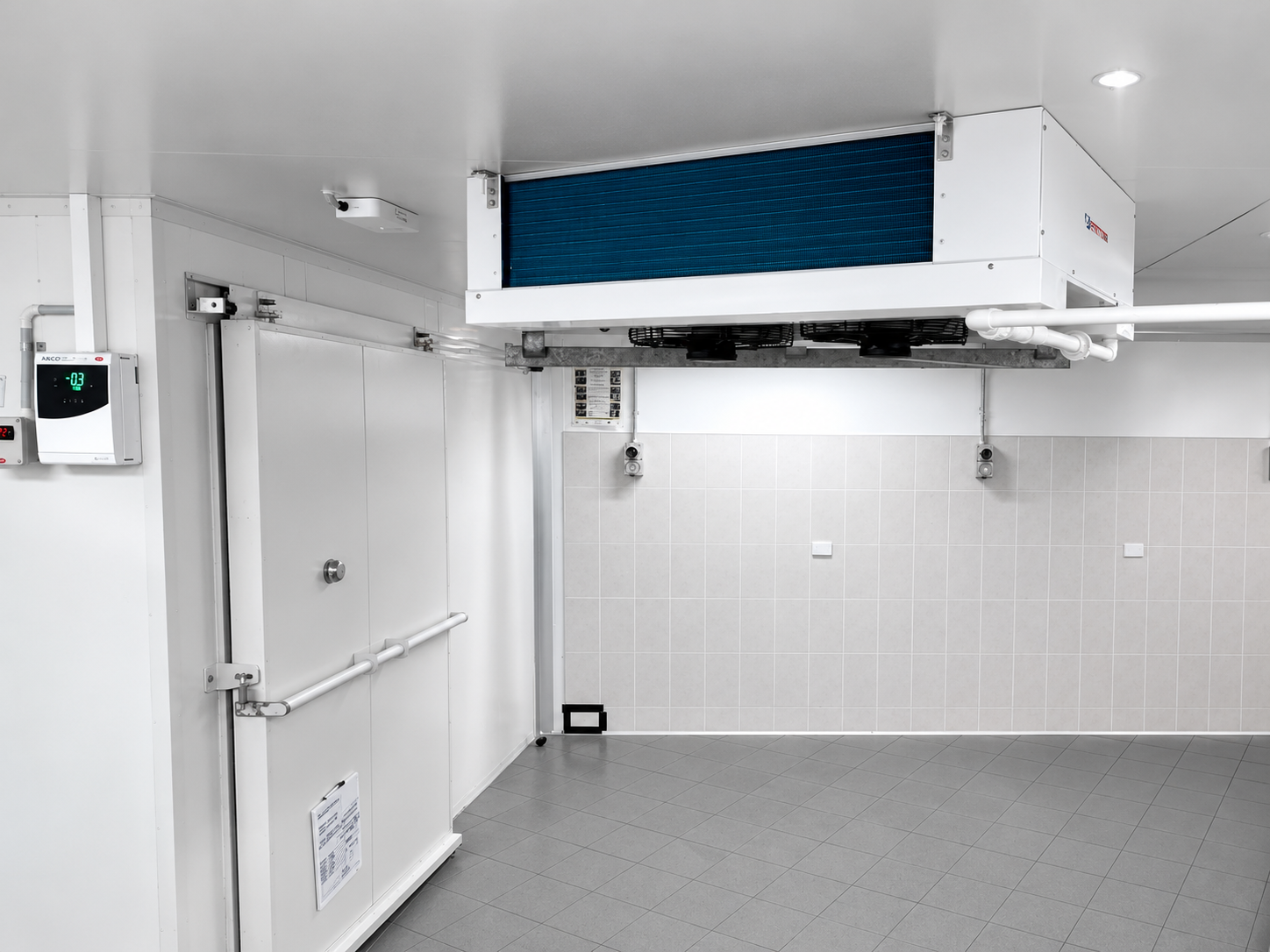 A spotless SETPOINT-installed coldroom with a low-profile evaporator, controller and tiled walls